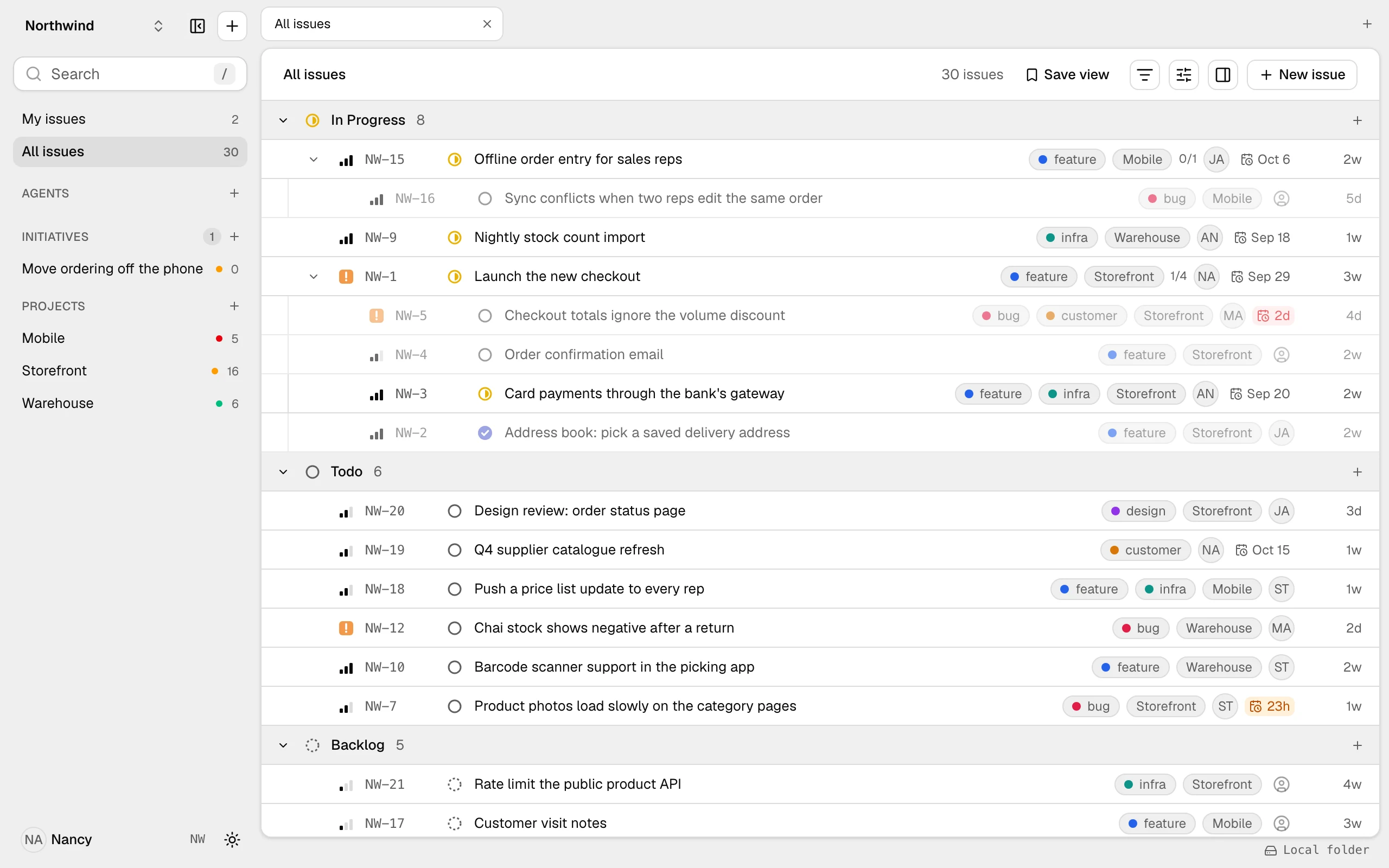litpm's issue list: thirty issues grouped by status, with sub-issues nested under their parent, labels, projects, assignees and due dates
